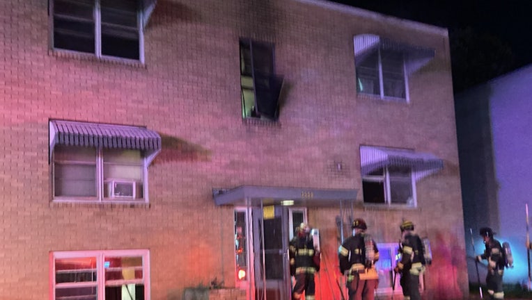 Minneapolis firefighters rescued an adult and a child from a fire at a three-story apartment building at 3550 Penn Ave N. early Wednesday morning.