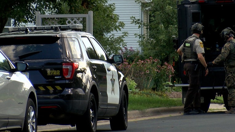 SWAT team members from Goodhue and Olmstead counties responded to a standoff with an armed man in southeast Pine Island on Saturday.