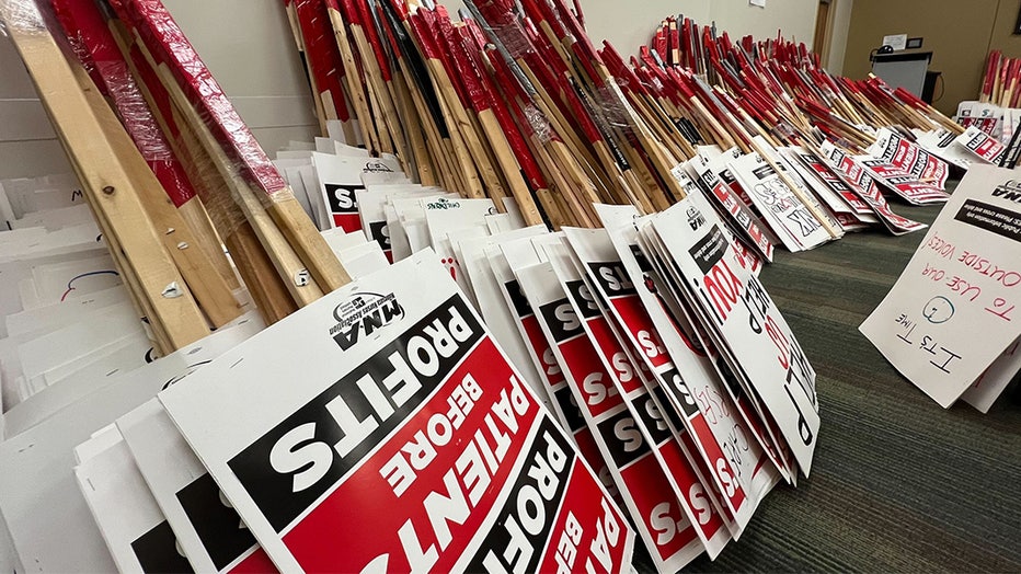 Signs stacked a press conference held by the Minnesota Nurses Association on Tuesday morning. (Bill Keller / Fox )