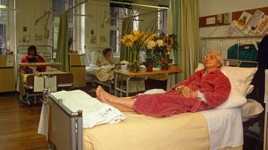 England - London - Elderly lady asleep on homoeopathic hospital bed