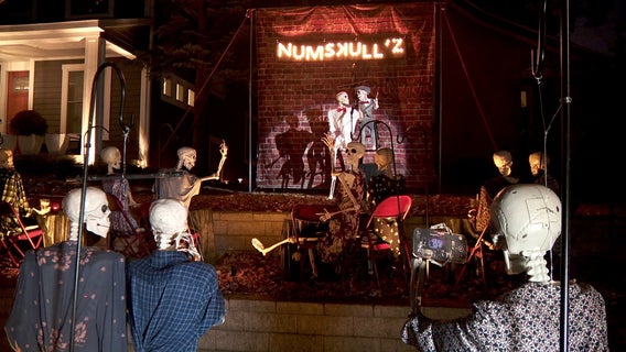 South Minneapolis homeowners create comedy club with skeletons in front yard