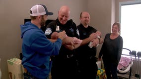 Allina EMS crew meets twin babies it helped deliver inside ambulance