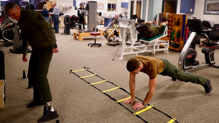A Ukrainian soldier, Dimitro, does pushups at the Novacare Rehabilitation Center in Crystal, Minnesota.