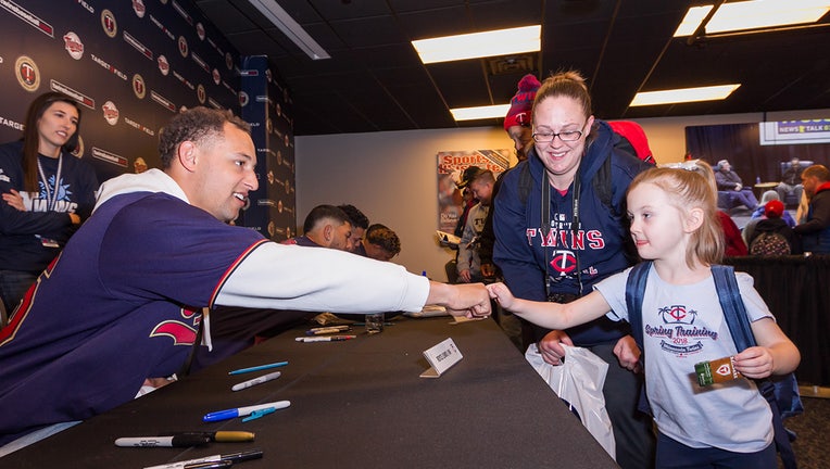 Minnesota Twins shortstop Royce Lewi fist-bumps a fan during a previous TwinFest.