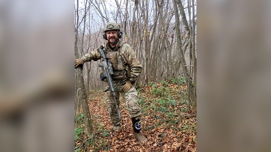 Niykola, a member of the Ukrainian Special Forces, shows of a prosthetic he obtained in Minnesota from the Protez Foundation. (Image courtesy of the Protez Foundation)