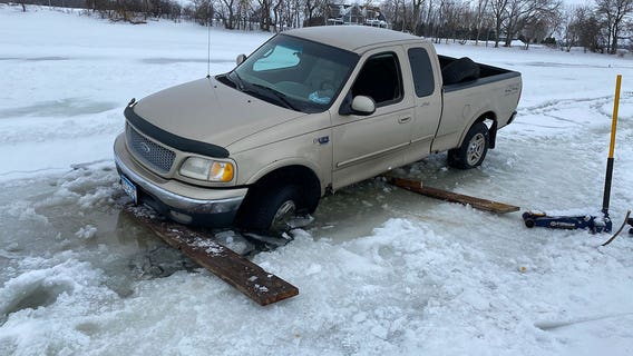 Truck plunges partially through ice on southern Minnesota lake