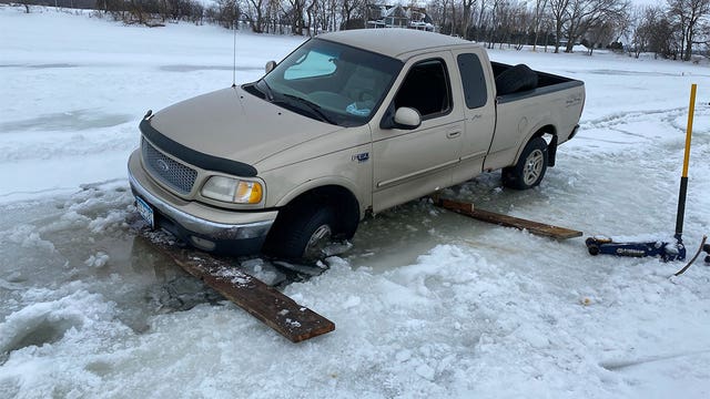 Truck plunges partially through ice on southern Minnesota lake