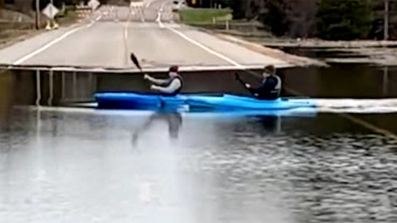 Kayakers cross flooded Minnesota road: 'So Minnesotan'