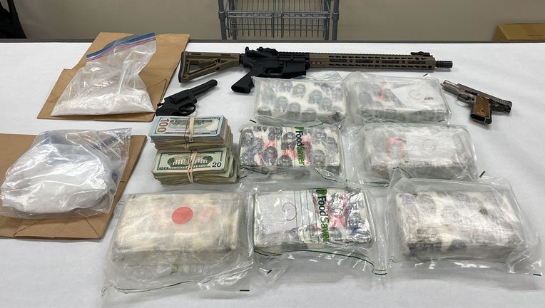 Law enforcement recovered cash, drugs and firearms during a search warrant at a Minneapolis home. (Credit Hennepin County Sheriffs Office)