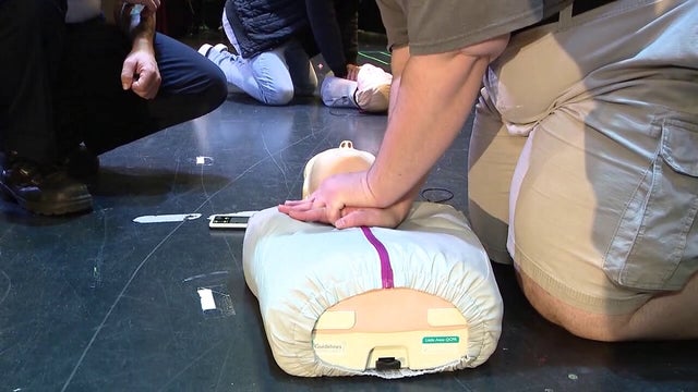 Young children learning how to perform CPR, call 911