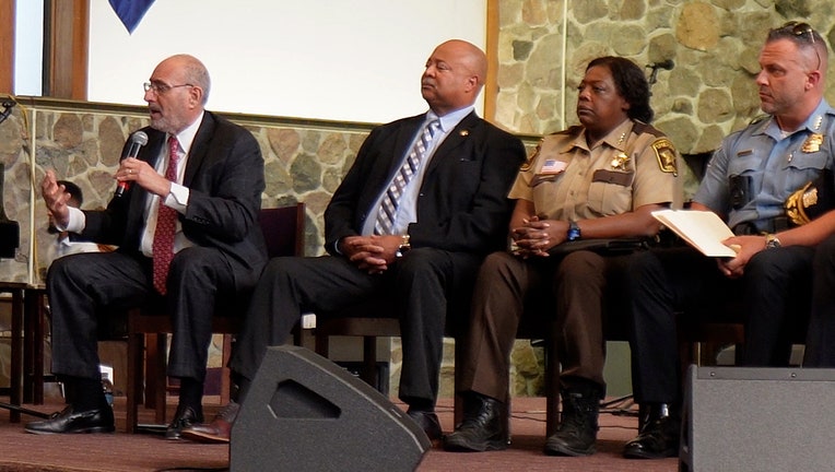 U.S. Attorney Andrew M. Luger speaks as U.S. Marshal the District of Minnesota Eddie Frizell, Hennepin County Sheriff Sheriff Dawanna S. Witt and Minneapolis Police Chief Brian O’Hara look on. (FOX 9)