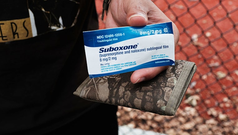 A heroin user holds suboxone during a project to interview Bronx drug users in order to compile data about overdoses on August 8, 2017 in New York City. (Photo by Spencer Platt/Getty Images)