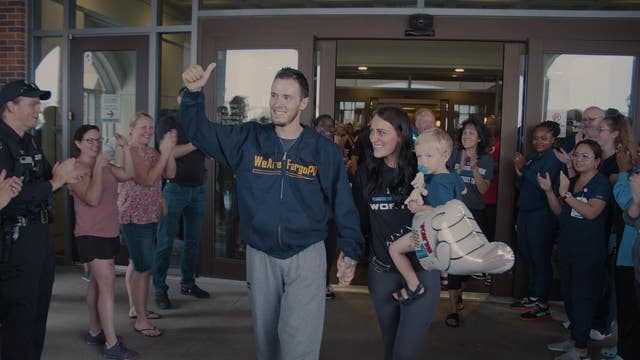 Fargo Police Officer Andrew Dotas leaves hospital