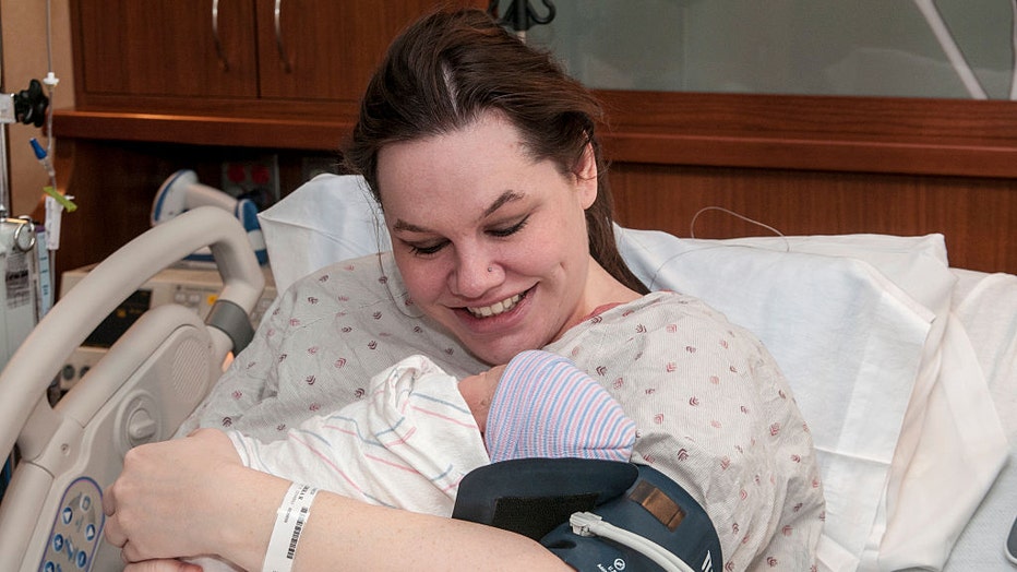 Woman-bonds-with-newborn-baby.jpg