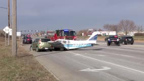 Small plane lands on road, strikes car in Brooklyn Park