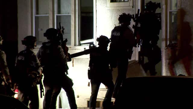 SWAT team searches abandoned house for suspects after fatal Minneapolis shooting