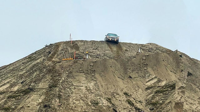 Disoriented driver misses construction sign, ends up in precarious spot