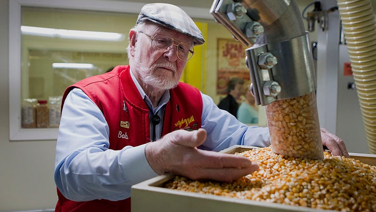 FILE - Bob Moore, founder of Bobs Red Mill and Natural Foods, inspects grains at the companys facility in Milwaukie, Oregon, U.S., on April 8, 2014. Photographer: Natalie Behring/Bloomberg via Getty Images