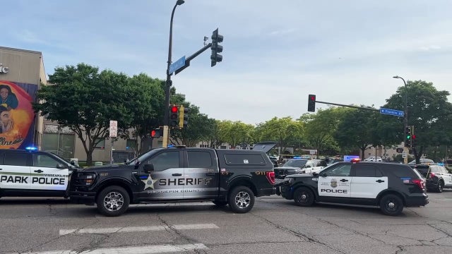 Minneapolis shooting: Witness tried to ram gunman with car before Officer Mitchell was killed