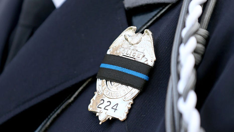 FILE - A Worcester police officers badge in memory of Enmanuel Manny Familia, who died attempting to save a drowning teen during the Massachusetts Law Enforcement Memorial at Ashburton Memorial Park on October 28, 2022, in Boston, Massachusetts. (Photo by Matt Stone/MediaNews Group/Boston Herald via Getty Images)
