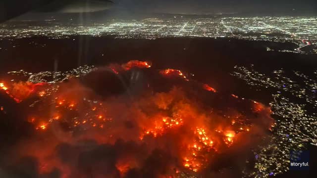 California wildfires: Plane passenger films aerial view of Palisades Fire