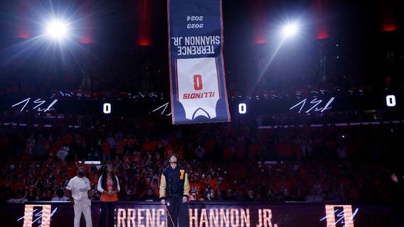 Terrence Shannon Jr. selling upside down shirts for Illinois Boys & Girls Club