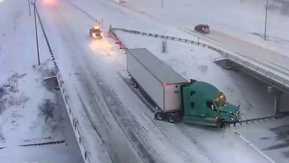Semi teetering on the edge of snowy overpass in Maplewood