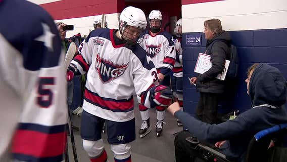Minnesota teen defies odds, reunites with hockey team after paralysis