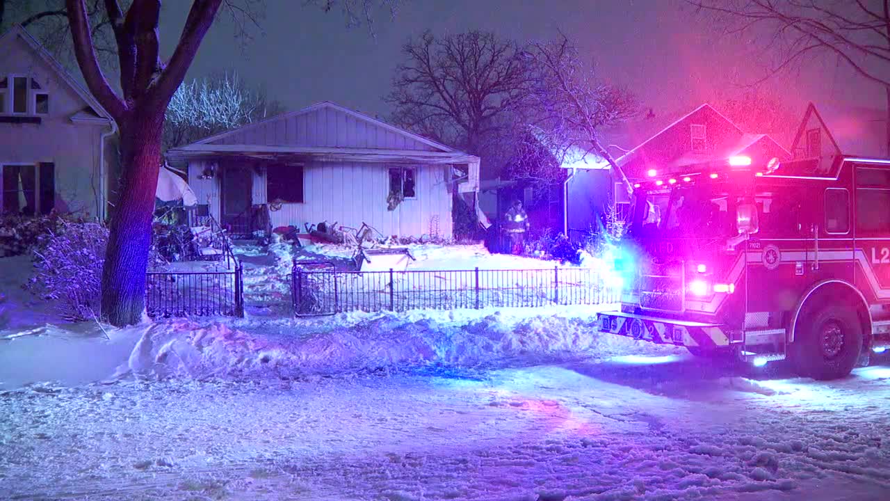 2 hurt after fires burns through 'over packed' Minneapolis home