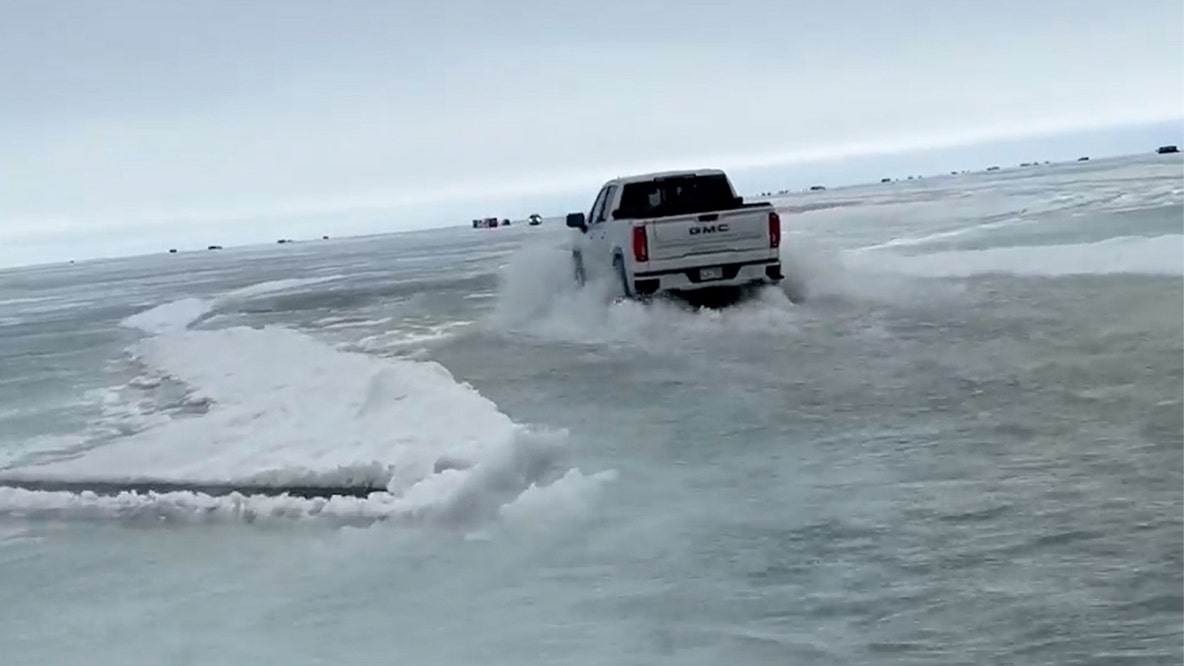 Viral video shows trucks driving through foot of water on thawing Minnesota lake
