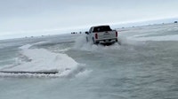 Viral video shows trucks driving through foot of water on thawing Minnesota lake