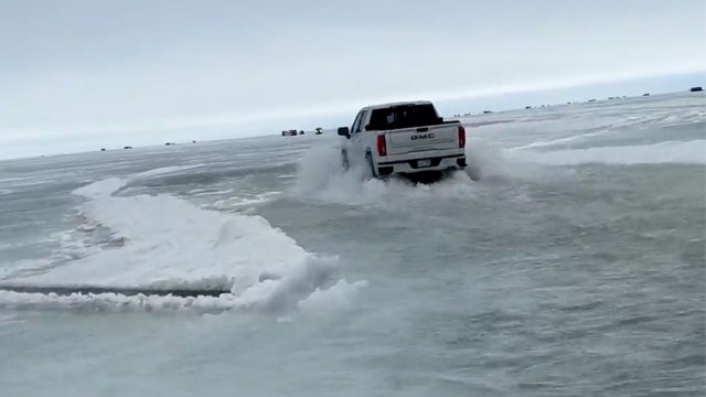 Viral video shows trucks driving through foot of water on thawing Minnesota lake