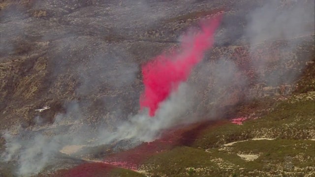 Crews battling brush fire burning along I-5 near Castaic
