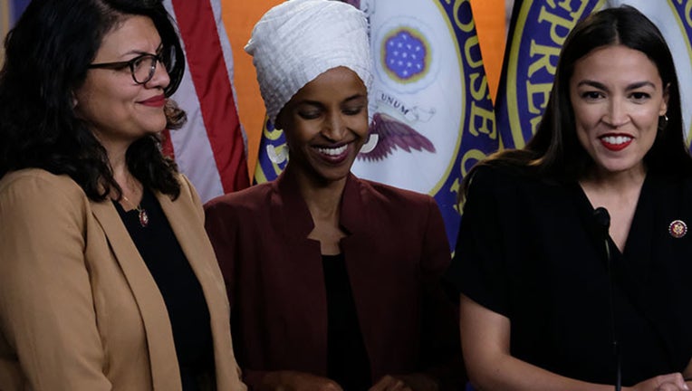 U.S. Reps. Rashida Tlaib (D-MI), Ilhan Omar (D-MN) and Alexandria Ocasio-Cortez (D-NY) listen during a news conference at the U.S. Capitol on July 15, 2019 in Washington, DC. (Photo by Alex Wroblewski/Getty Images)