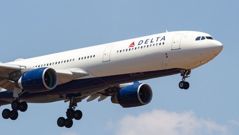 9707da36-A Delta Airlines flight is shown in a file photo. (Photo by Nicolas Economou/NurPhoto via Getty Images)