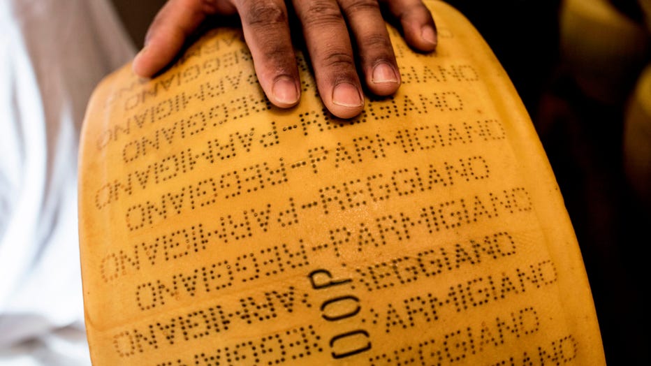 Parmigiano cheese is shown in a file photo taken at a Parmigiano Reggiano factory in the Dall'Aglio Farm on September 1, 2018 in Gattatico, near Reggio Emilia. (Photo credit: MARCO BERTORELLO/AFP/Getty Images)