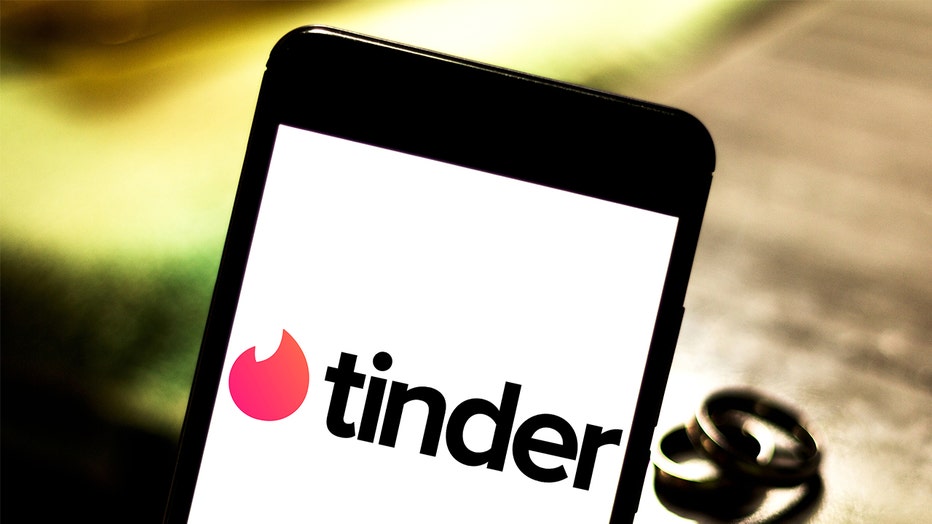 FILE - Tinder logo seen displayed on a smartphone.