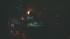 Fire crews work to knock down commercial fire in Santa Ana