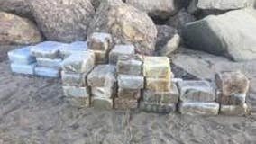 Beached panga carrying dozens of bales of marijuana located in Malibu