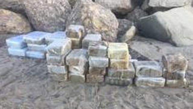 Beached panga carrying dozens of bales of marijuana located in Malibu