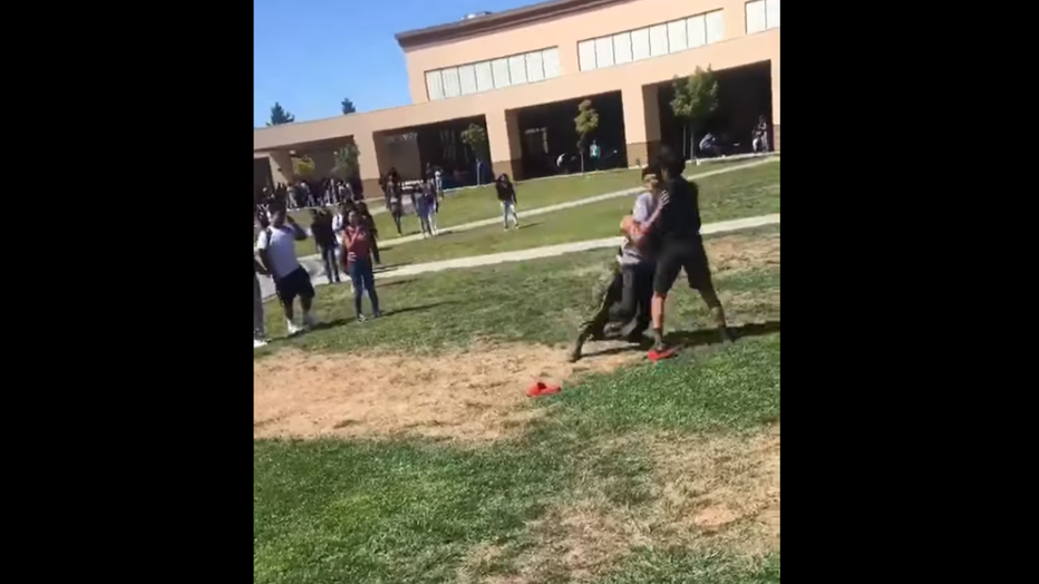 A U.S. Marine tackles two high school students in Stockton, Calif.