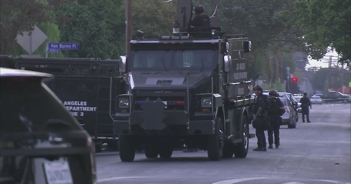 SWAT team surrounds assault suspects barricaded in South LA home | FOX ...