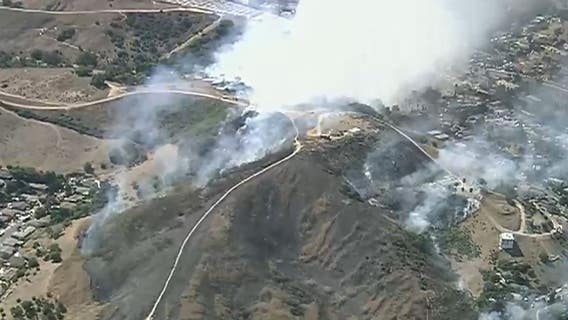 Fire crews work to knock down terrain-driven fire near East L.A.