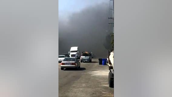 House fire in Fontana sparks blaze in nearby vegetation area