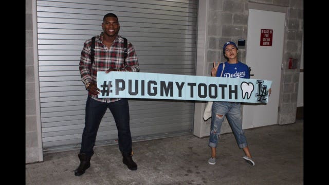 Yasiel Puig meets with fan after accidentally knocking out her tooth