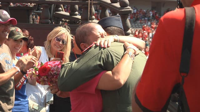 Air Force captain surprises mom battling cancer at Bucs game