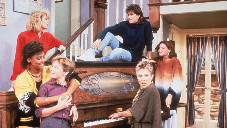 Cast members from the television series 'The Facts of Life' stand around a piano, circa 1987. (L-R front) Kim Fields, MacKenzie Astin and Cloris Leachman. (L-R rear) Lisa Welchel, Nancy McKeon and Mindy Cohn.