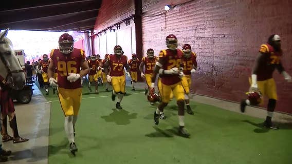 USC football team beats UCLA, 52-35