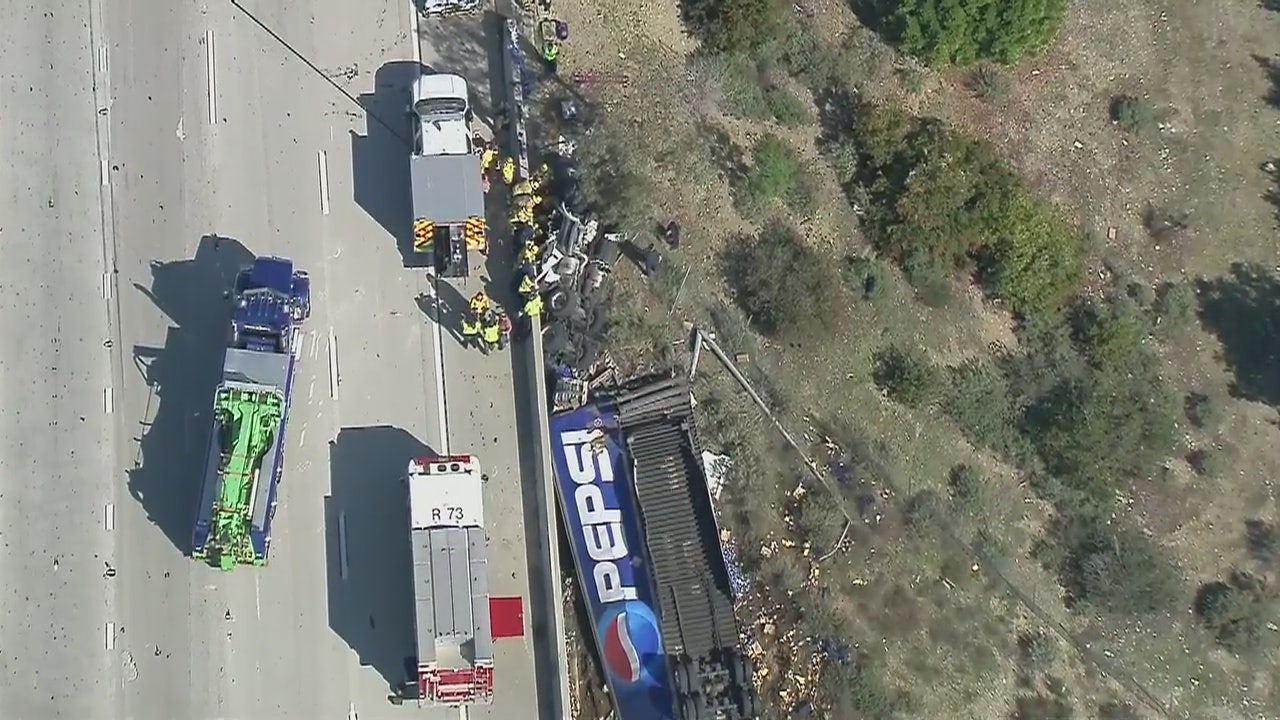 Pepsi truck falls off the 15 Freeway in Fontana, driver airlifted to