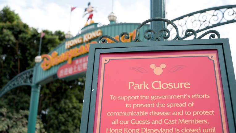 A sign announcing the park's closure is pictured at the entrance to Hong Kong Disneyland in Hong Kong on January 26, 2020, after it announced it was shutting its doors until further notice over a deadly virus outbreak in central China. (Photo by Ayaka MCGILL / AFP) (Photo by AYAKA MCGILL/AFP via Getty Images)